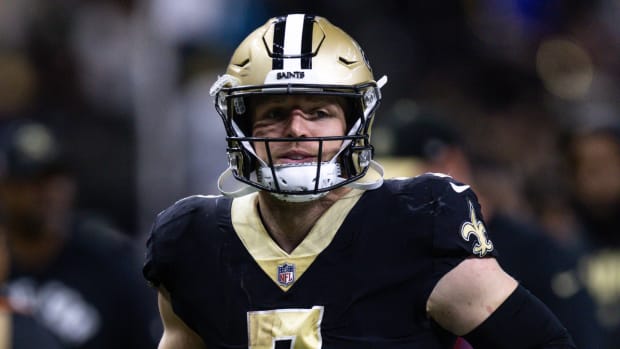 Saints tight end Taysom Hill runs off the field.
